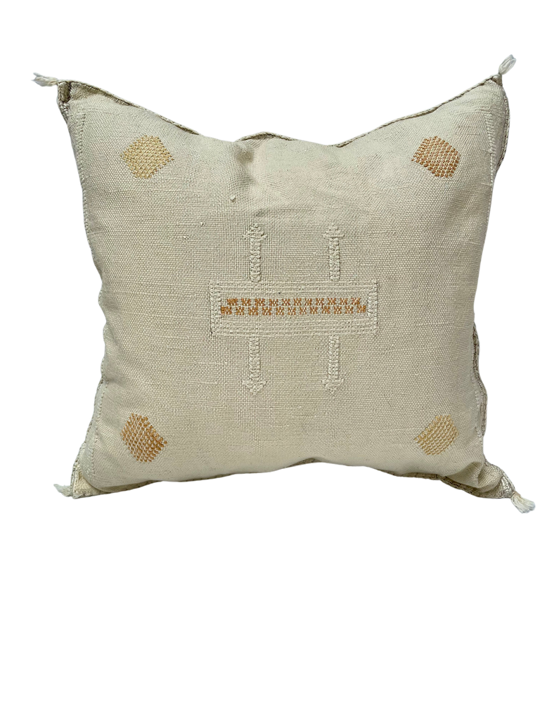 A stylish Moroccan cactus silk cushion  with tribal motifs and neutral colors.