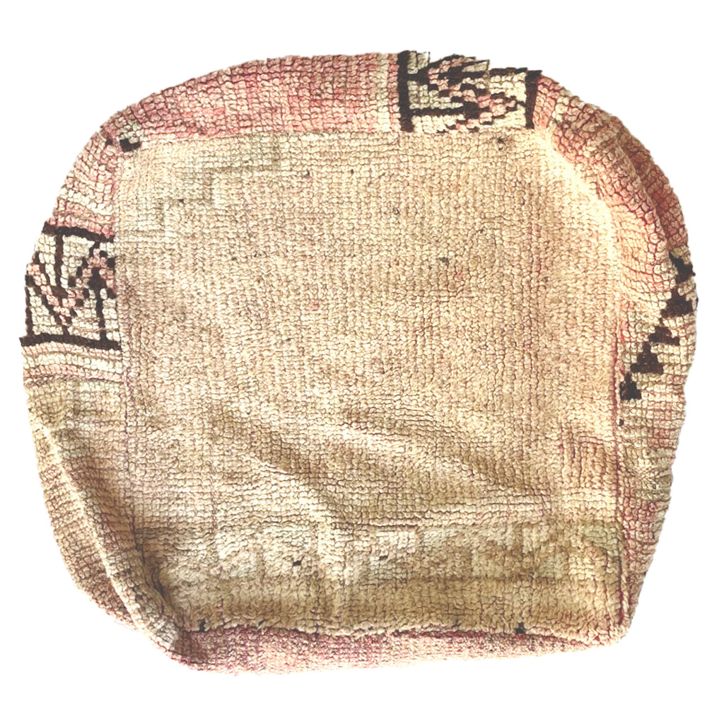Vintage Moroccan floor cushion with neutral colors.