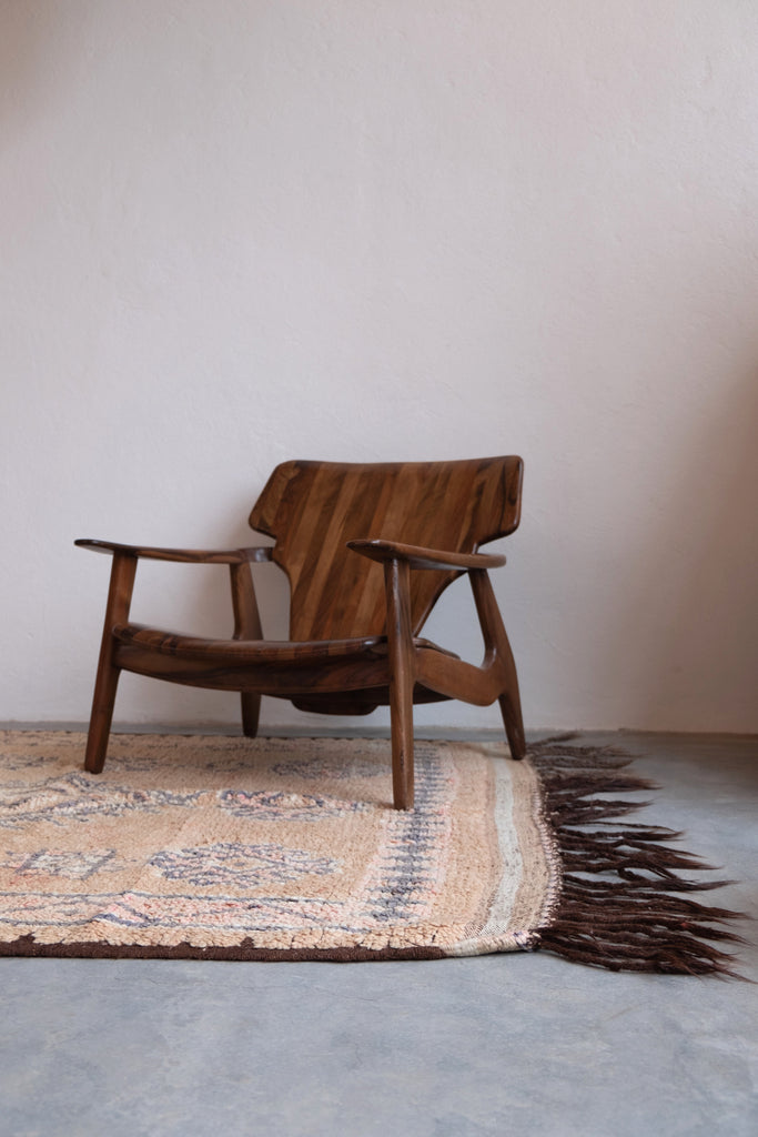 Vintage Moroccan rug featuring traditional tribal motifs and neutral colors.