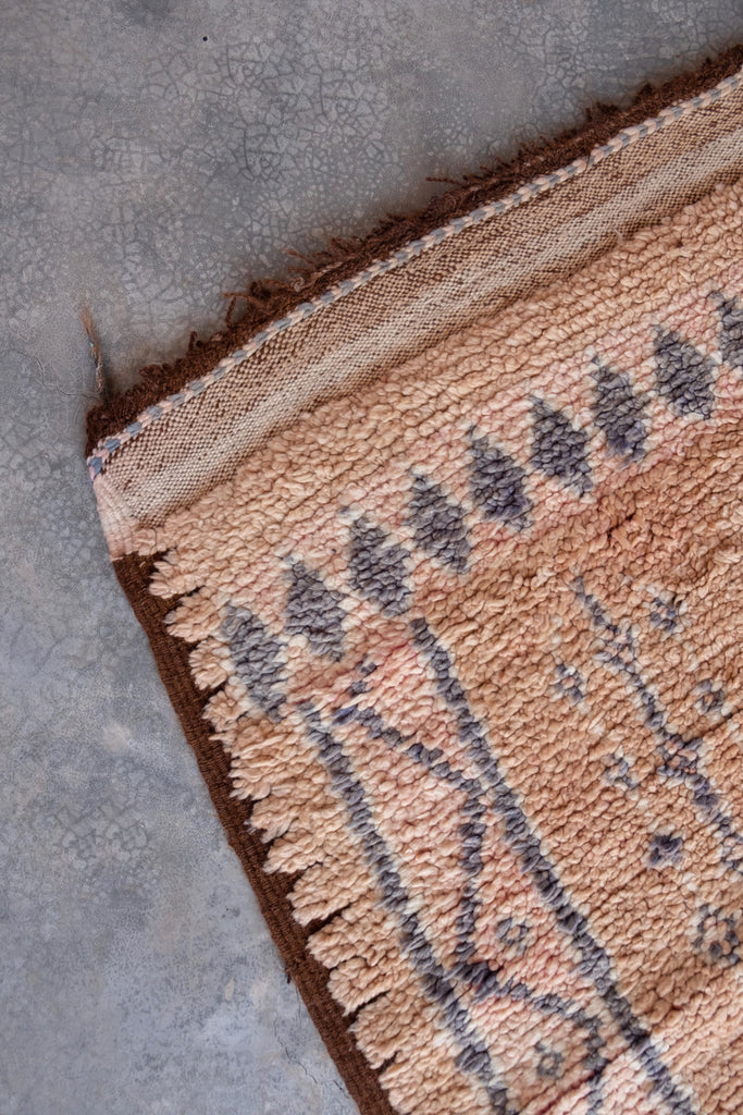Vintage Moroccan rug showcasing traditional Berber motifs.