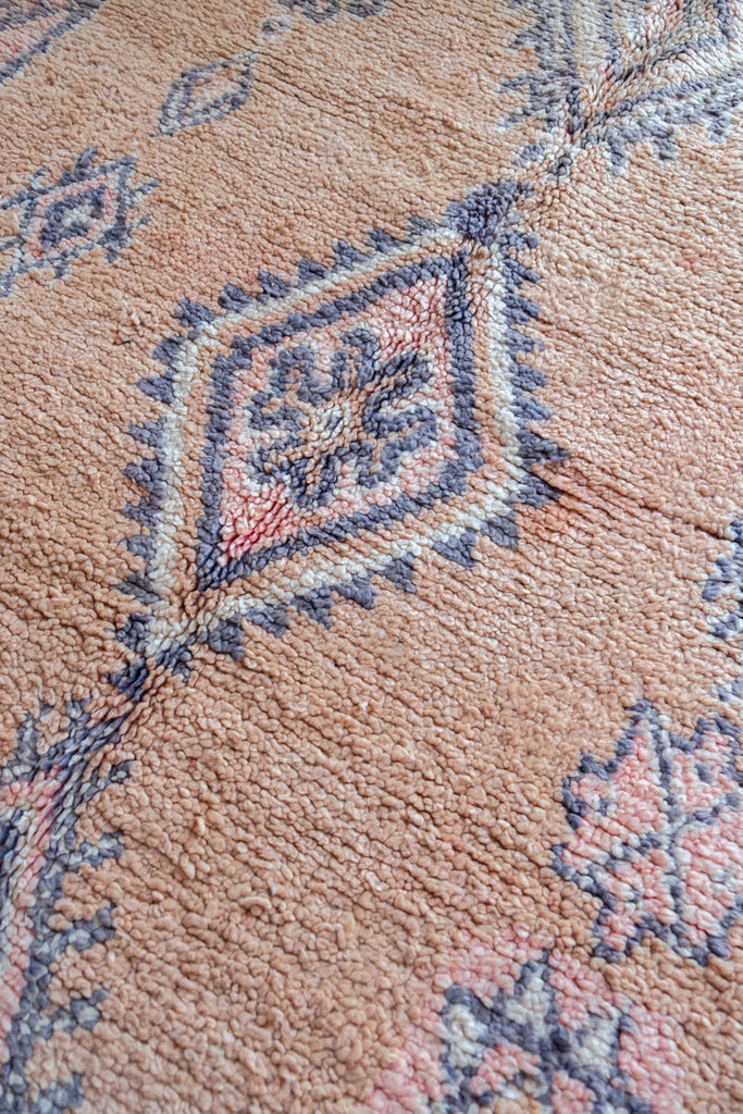Vintage Moroccan rug  featuring traditional Berber motifs.