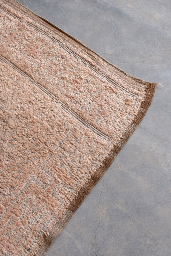 Vintage Moroccan rug showcasing contemporary tribal patterns.