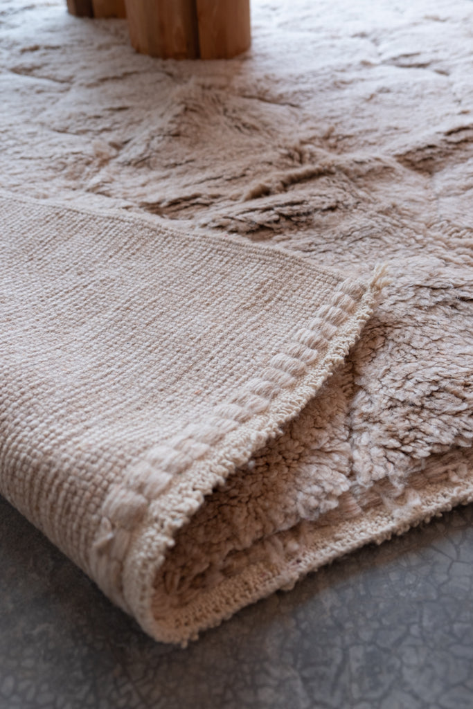 Contemporary Moroccan rug showcasing tribal motifs and earthy tones, complementing various decor styles.