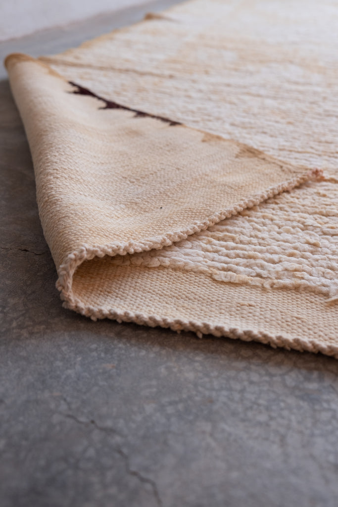 The vintage Moroccan rug  with its rich tribal heritage, timeless available at Moroccan Tribe.