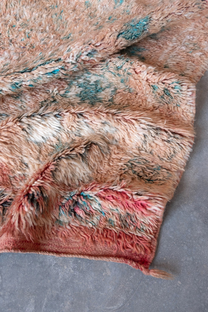 Vintage Moroccan rug featuring traditional Berber motifs.