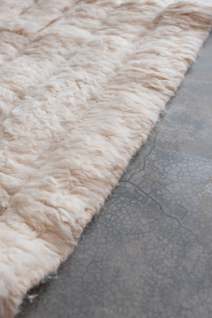 Vintage Moroccan rug with neutral colors.