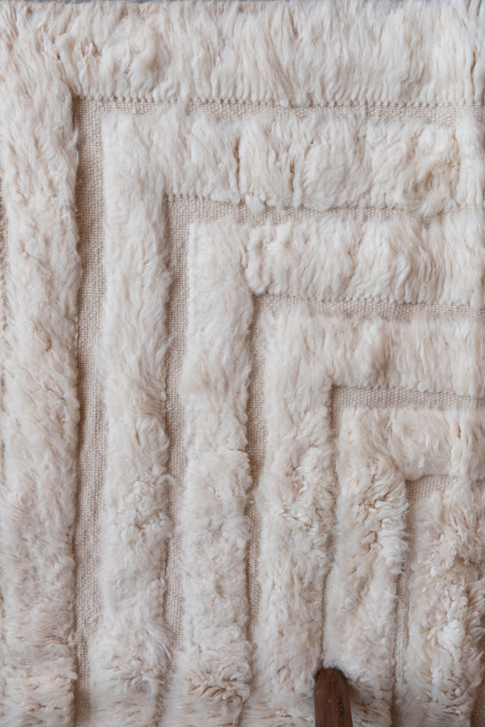 Cream contemporary Moroccan rug featuring intricate designs and neutral shades, a timeless addition to any room.