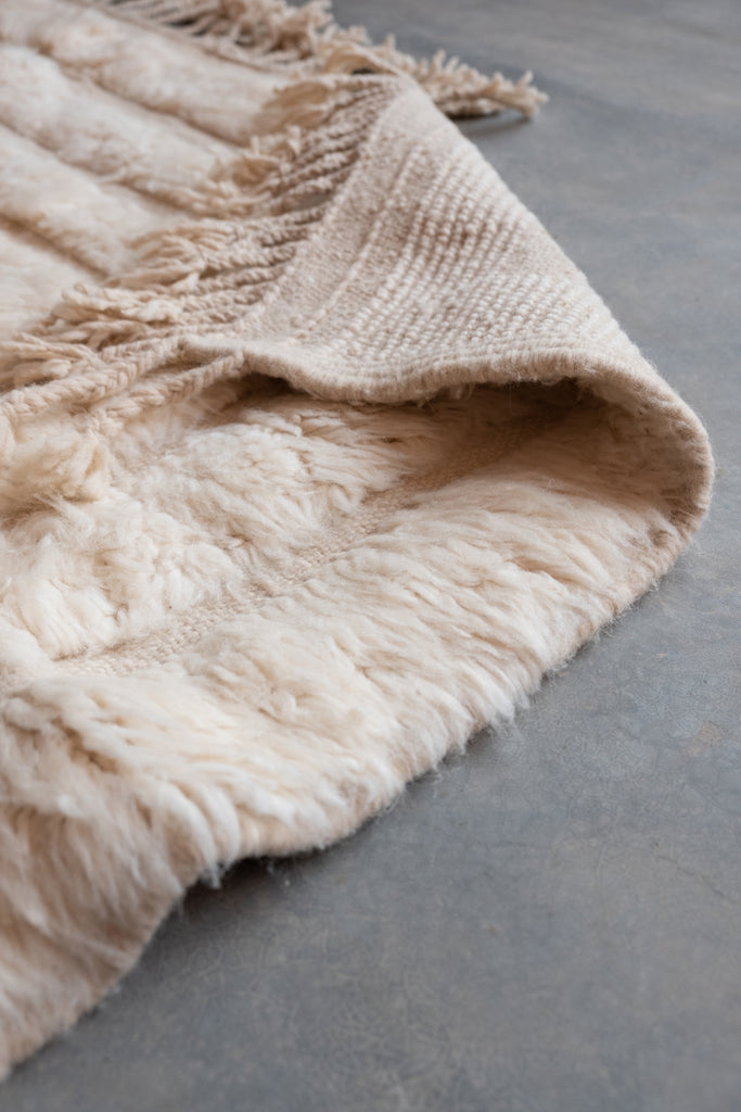 Contemporary Moroccan rug  with traditional patterns and a blend of neutral shades, ideal for any room.