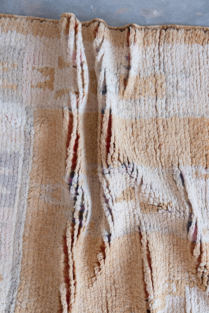 Vintage Moroccan rug showcasing intricate tribal patterns and vintage designs.