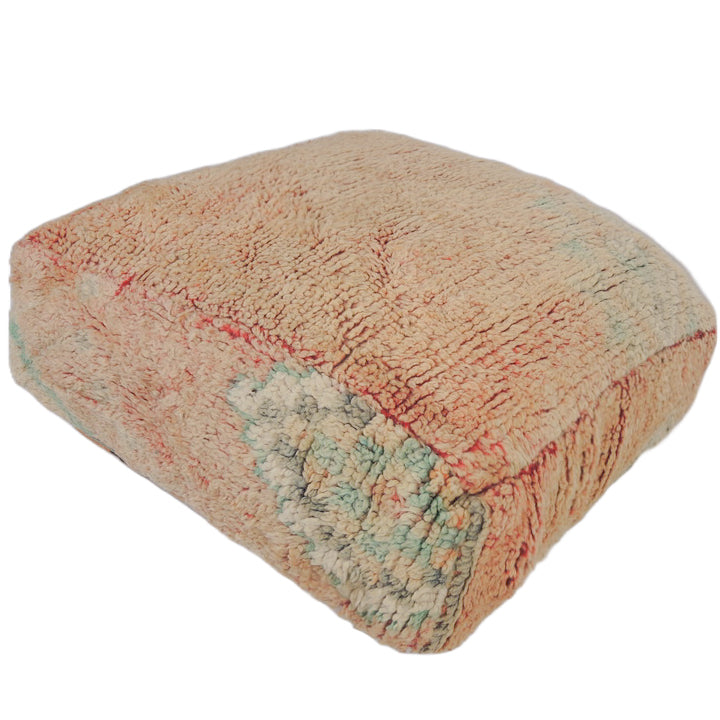 Vintage Moroccan floor cushion in faded pink.