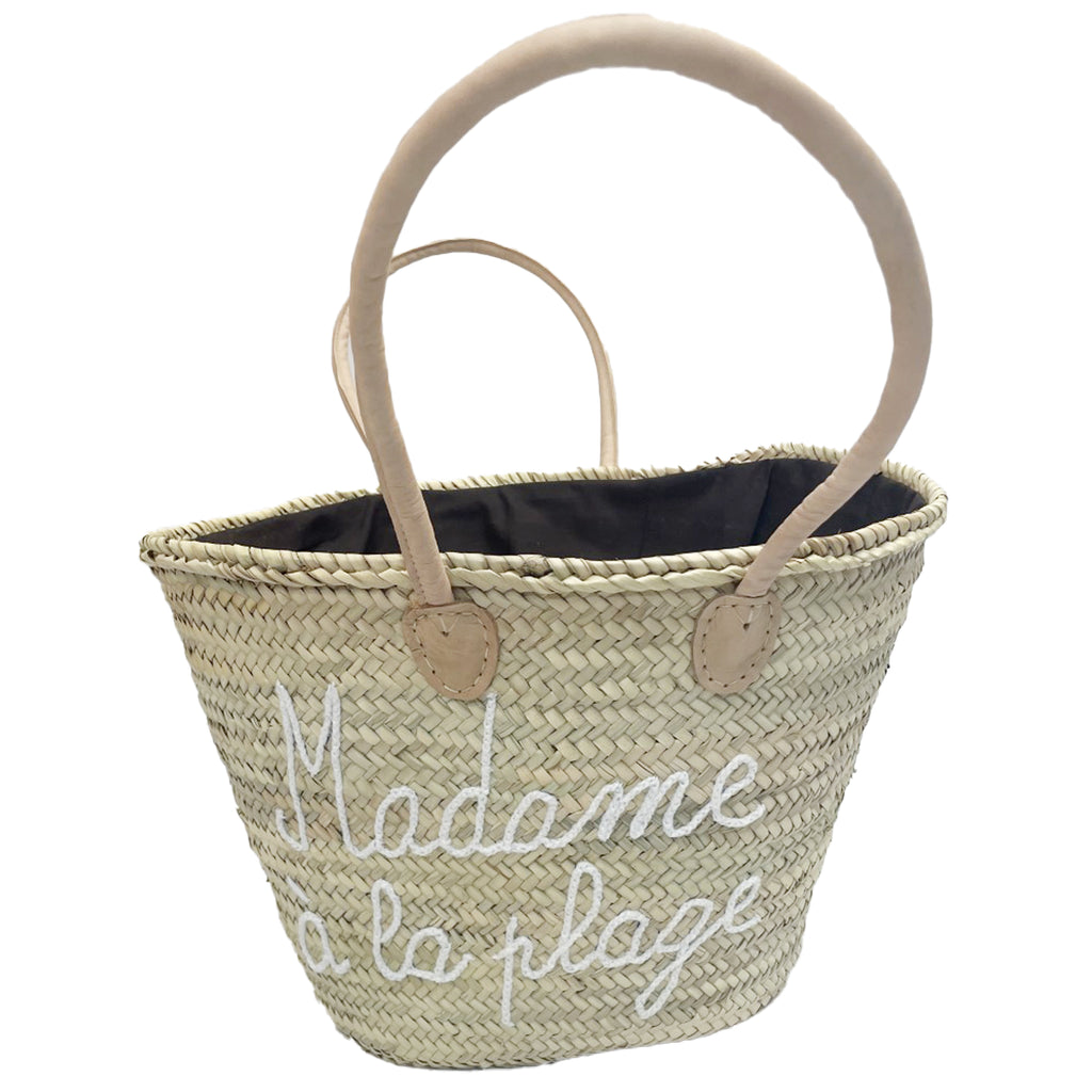 handmade beach bag with white stitching as seen in Baku swimware stores, shopping in Australia. 